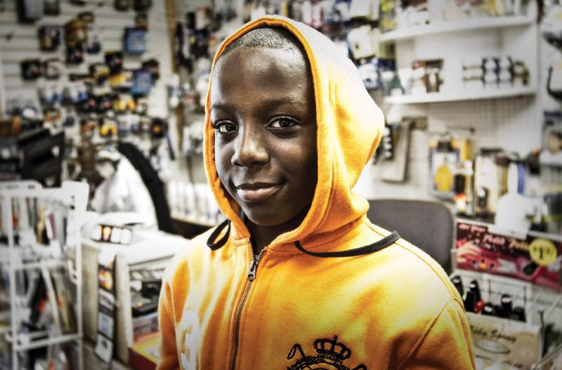 Nine-year-old D.K. Ofuku at Christine’s Discount Store on Green-mount Avenue. 