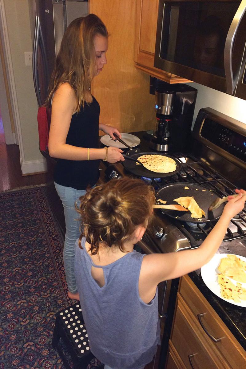 French-speaking sisters Margot and Rose Deguet Delury prepare French crépes.