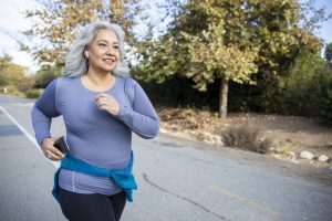 Woman with gray hair jogging