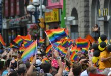 people wave pride flags