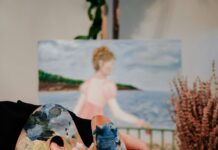 Things to Do This Weekend in Baltimore (April 17-19) A person with a paint palette sits in front of an impressionist painting