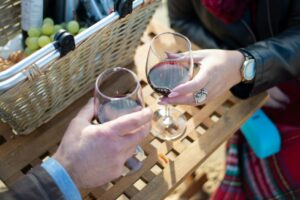 People drinking wine outside