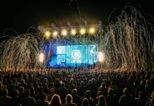 Things to Do This Weekend in Baltimore (July 24-26) People look at a stage at an outdoor music festival