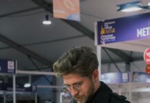 Things to Do This Weekend in Baltimore (Sept. 25-26) A man looks through a book at a book sale